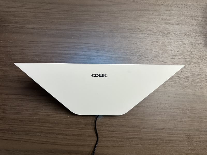 Angular ABS-B fly trap with triangular housing installed in a modern venue